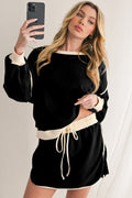 Conjunto Negro de Jersey Holgado con Ribete y Falda-Short Cruzada | Detallia